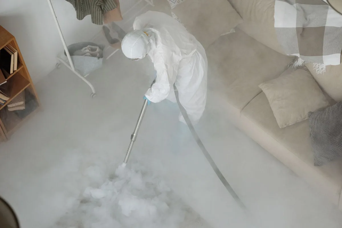 Biohazard cleanup technician in protective equipment, Sheridan, OR